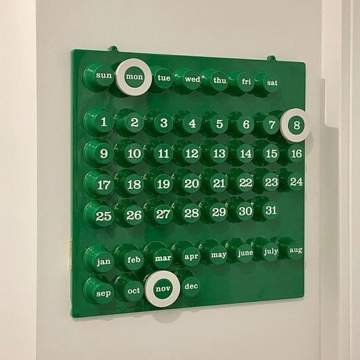 Minimal 3D printed sliding calendar magnet on fridge
