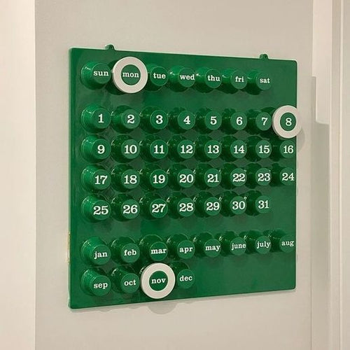 Minimal 3D printed sliding calendar magnet on fridge